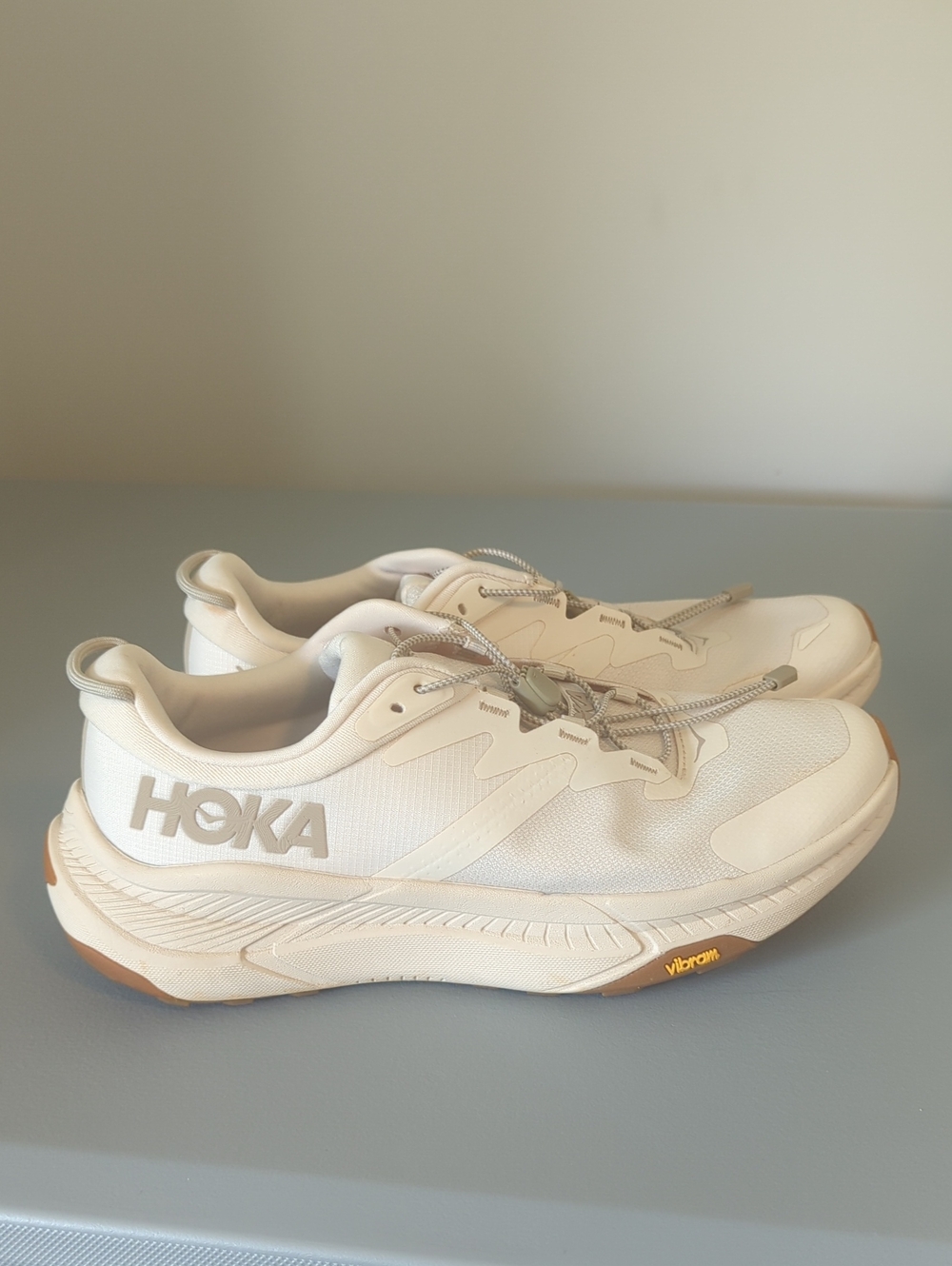 HOKA Transport sneakers in an "Eggnog" Color. Toggle Laces